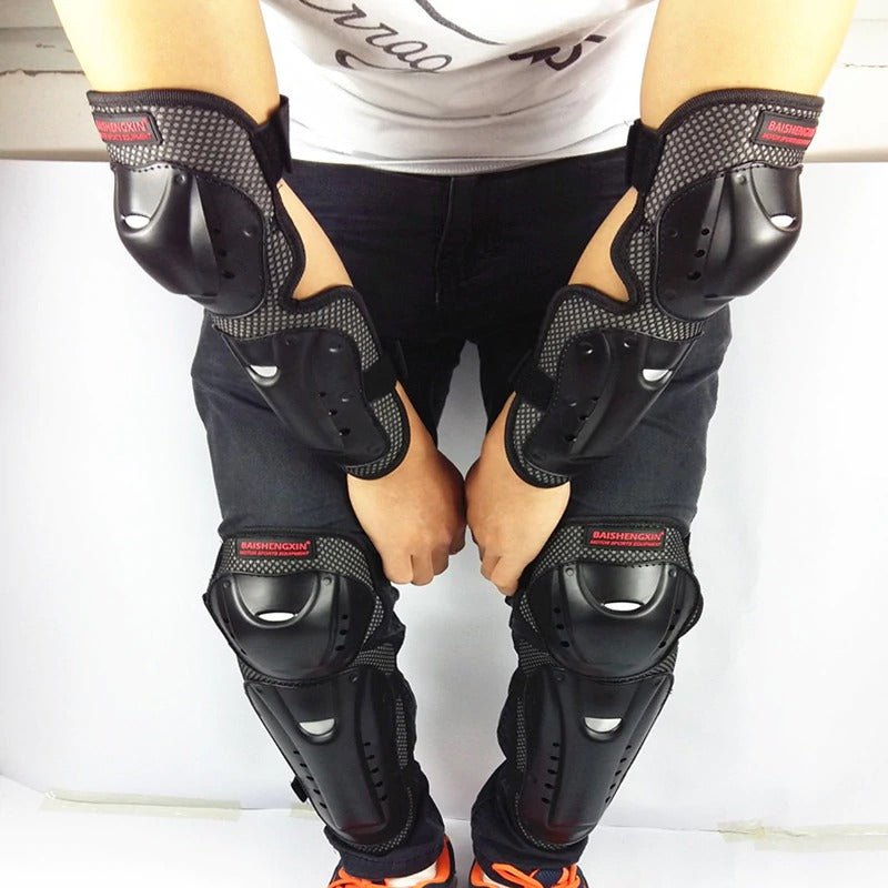 Motorcycle rider wearing 4-piece protective gear set with knee and elbow pads